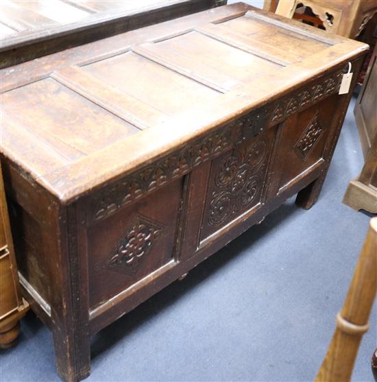 An 18th century oak coffer, W.124cm